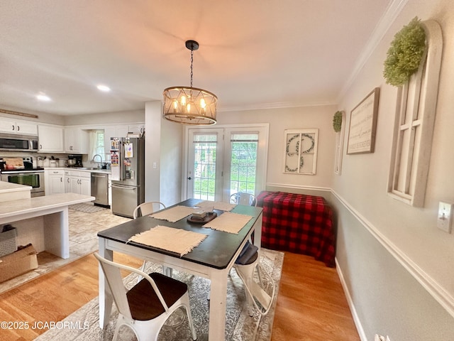 405 Lorene St, California, MO 65018 - dining space featuring a chandelier, light wood finished floors, crown molding, french doors, and recessed lighting