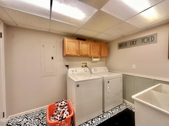 405 Lorene St, California, MO 65018 - washroom with electric panel, washing machine and dryer, a wainscoted wall, and cabinet space