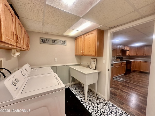 405 Lorene St, California, MO 65018 - laundry room with washing machine and dryer, cabinet space, and dark wood-style flooring