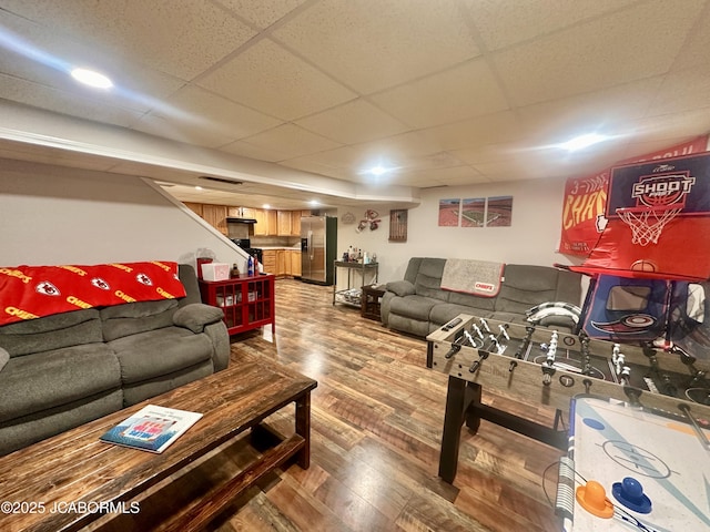 405 Lorene St, California, MO 65018 - living room with wood finished floors, a paneled ceiling, and stairway