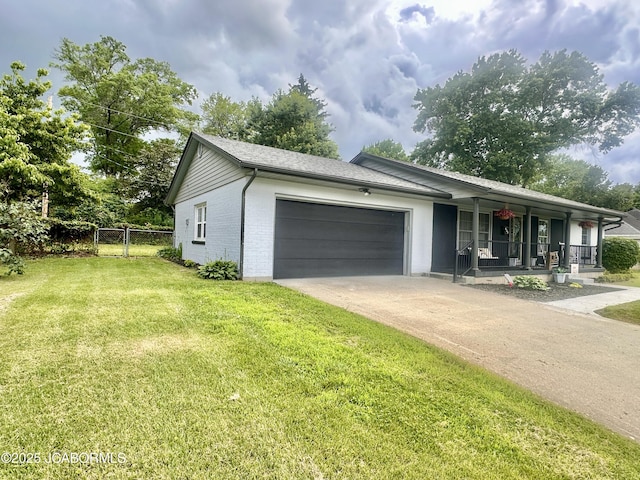 405 Lorene St, California, MO 65018 - ranch-style house featuring covered porch, an attached garage, concrete driveway, and brick siding