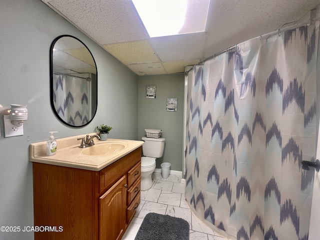 405 Lorene St, California, MO 65018 - full bathroom featuring marble look tile flooring, vanity, a drop ceiling, and a shower with shower curtain