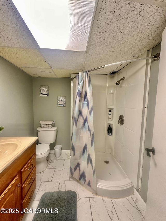 405 Lorene St, California, MO 65018 - bathroom featuring marble look tile flooring, a shower with shower curtain, vanity, and a drop ceiling