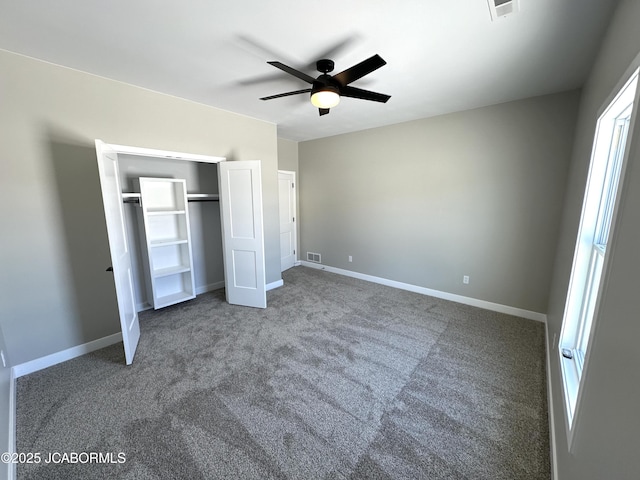 unfurnished bedroom featuring carpet flooring, ceiling fan, and a closet