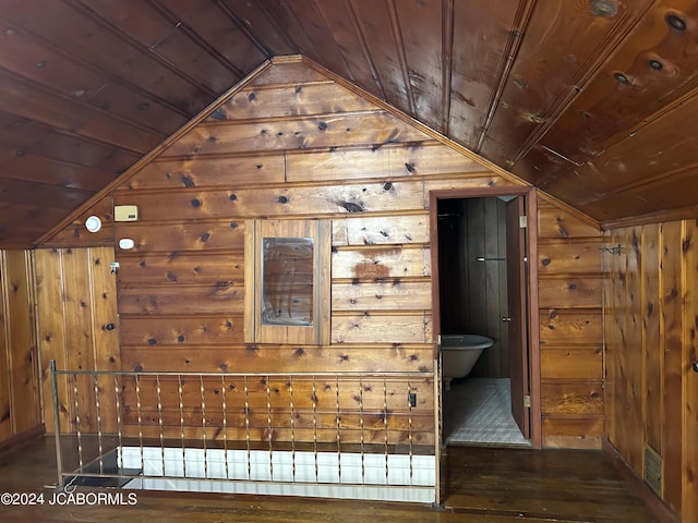 bonus room featuring wood ceiling, lofted ceiling, wooden walls, and dark wood-type flooring