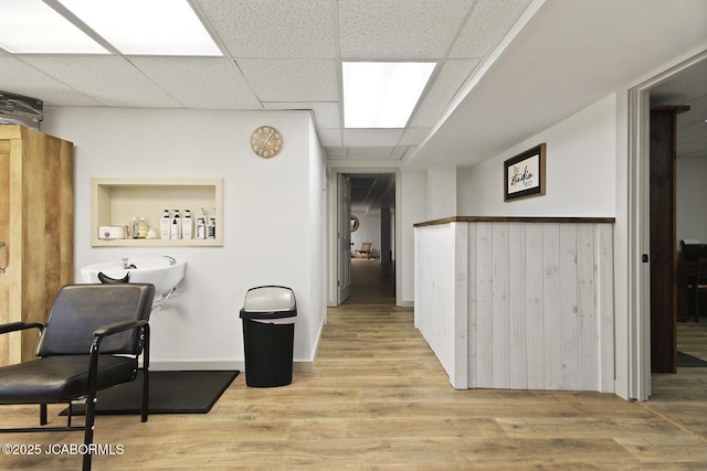 140 County Road 412, Fayette, MO 65248 - corridor with wood finished floors, a drop ceiling, wainscoting, and a sink