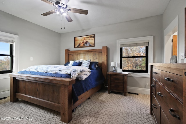 140 County Road 412, Fayette, MO 65248 - bedroom featuring light colored carpet, baseboards, and ceiling fan