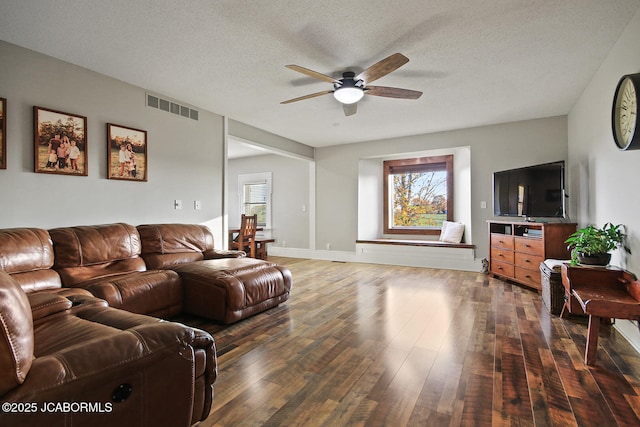 140 County Road 412, Fayette, MO 65248 - living area with ceiling fan, wood finished floors, and a textured ceiling