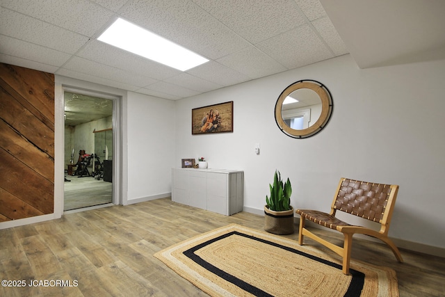 140 County Road 412, Fayette, MO 65248 - living area featuring wood finished floors, baseboards, and a paneled ceiling