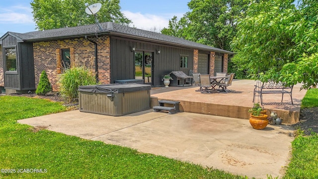 140 County Road 412, Fayette, MO 65248 - view of patio featuring a hot tub, french doors, and outdoor dining space