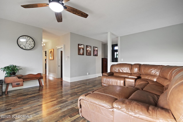 140 County Road 412, Fayette, MO 65248 - living area featuring ceiling fan, wood finished floors, and baseboards