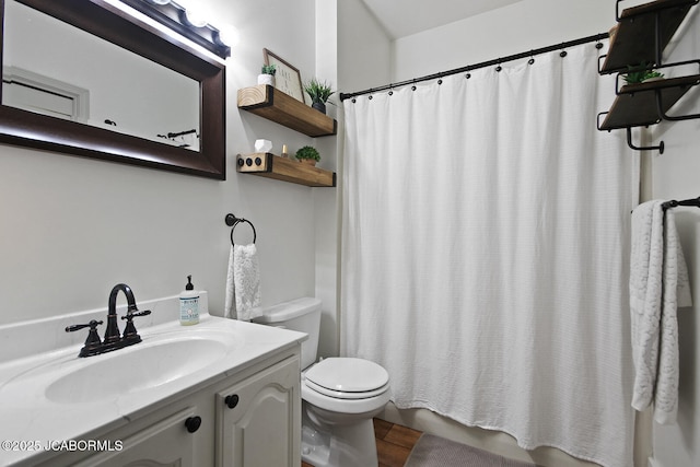 140 County Road 412, Fayette, MO 65248 - full bath featuring toilet, vanity, wood finished floors, and shower / tub combo with curtain