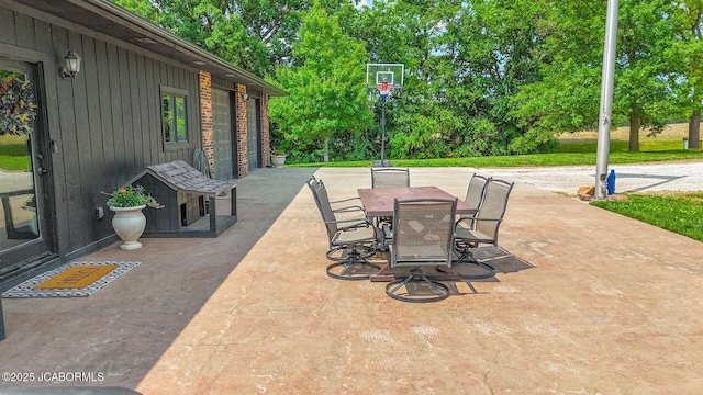 140 County Road 412, Fayette, MO 65248 - view of patio with outdoor dining area and view of scattered trees
