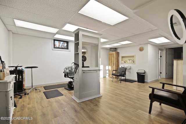 140 County Road 412, Fayette, MO 65248 - workout room with a paneled ceiling, wood finished floors, and baseboards