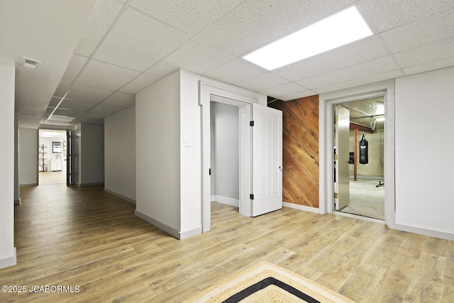 140 County Road 412, Fayette, MO 65248 - spare room featuring a drop ceiling, wood finished floors, and baseboards