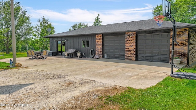 140 County Road 412, Fayette, MO 65248 - view of property exterior featuring brick siding, a garage, roof with shingles, and concrete driveway