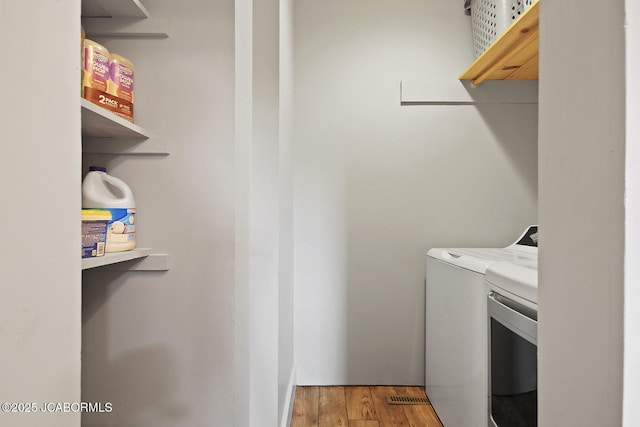140 County Road 412, Fayette, MO 65248 - laundry area with washing machine and dryer and light wood finished floors
