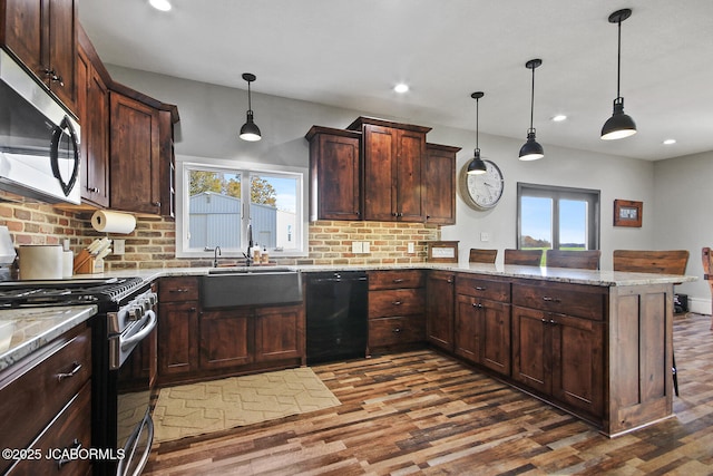 140 County Road 412, Fayette, MO 65248 - kitchen featuring stainless steel appliances, a peninsula, dark wood-style floors, backsplash, and a sink