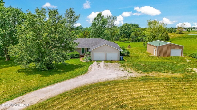 3861 State Road H, Fulton, MO 65251 - view of front of home featuring a garage, a front yard, and an outdoor structure