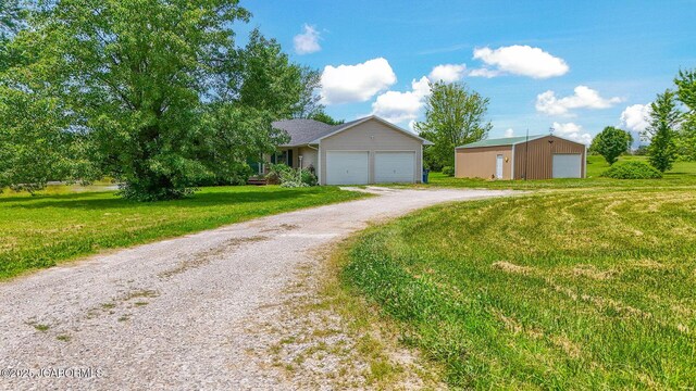 3861 State Road H, Fulton, MO 65251 - single story home with a front lawn, a detached garage, and driveway
