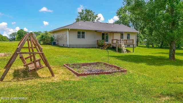 3861 State Road H, Fulton, MO 65251 - back of house featuring a vegetable garden, a yard, and a wooden deck