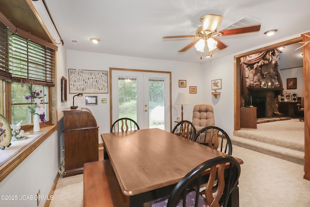 9542 Osage Ct, Williamsburg, MO 63388 - dining space with french doors, ceiling fan, and light carpet