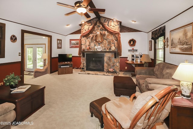 9542 Osage Ct, Williamsburg, MO 63388 - living area featuring ceiling fan, vaulted ceiling, a fireplace, carpet floors, and healthy amount of natural light
