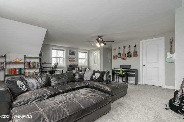 carpeted living room with ceiling fan