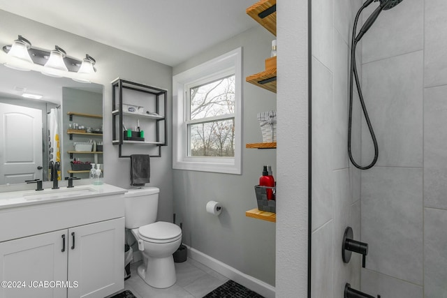 bathroom featuring tile patterned floors, vanity, toilet, and walk in shower