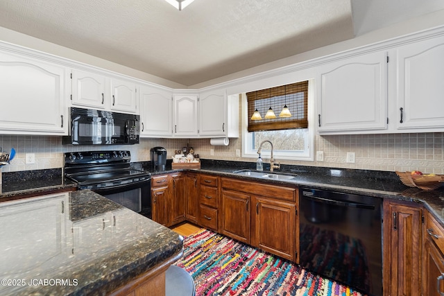 1548 Skyview, Holts Summit, MO 65043 - kitchen featuring black appliances, a sink, white cabinets, and decorative backsplash