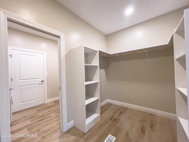 walk in closet featuring visible vents and light wood-style flooring