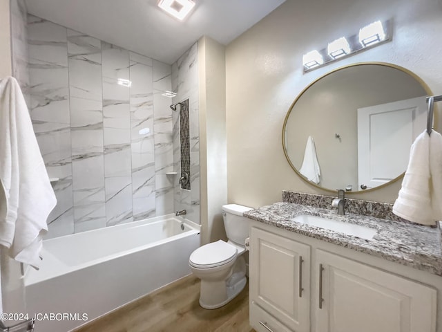 full bath featuring vanity, wood finished floors, visible vents, tub / shower combination, and toilet