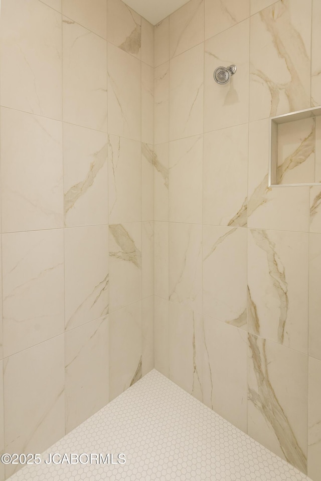 full bathroom with tiled shower