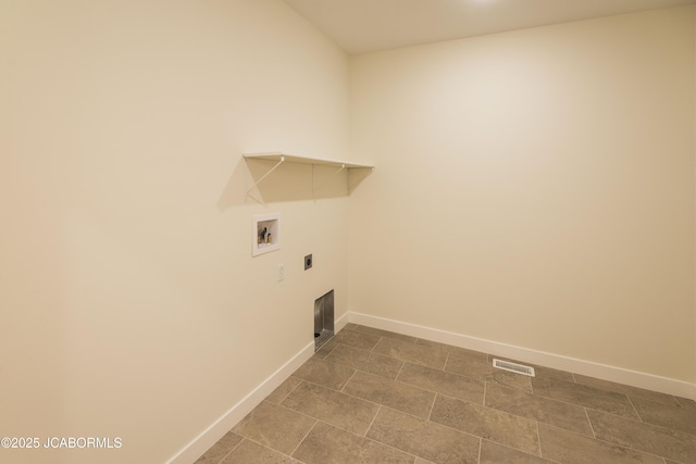 washroom with hookup for an electric dryer, laundry area, baseboards, and hookup for a washing machine