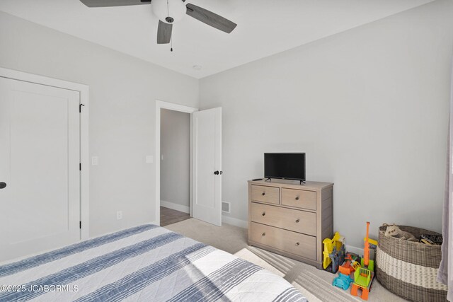 15005 Wrangle Ln, Ashland, MO 65010 - bedroom featuring baseboards, light colored carpet, and a ceiling fan
