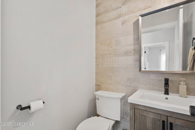 15005 Wrangle Ln, Ashland, MO 65010 - bathroom featuring toilet, tile walls, and vanity