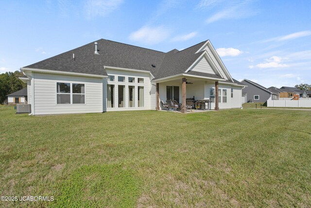 15005 Wrangle Ln, Ashland, MO 65010 - back of property with a yard, roof with shingles, central AC unit, and a patio area