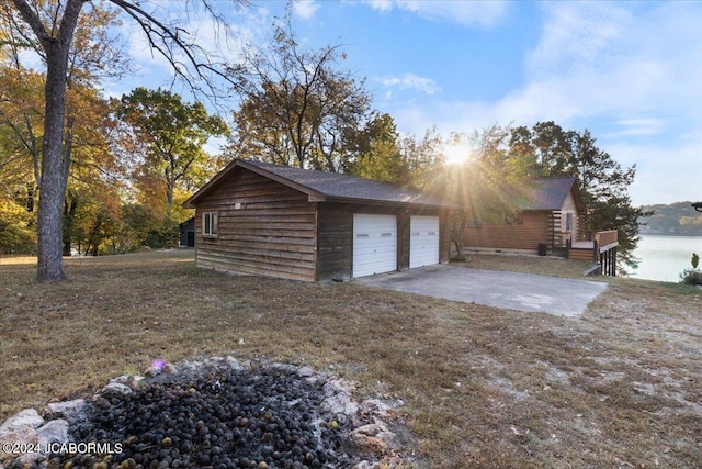 garage with concrete driveway