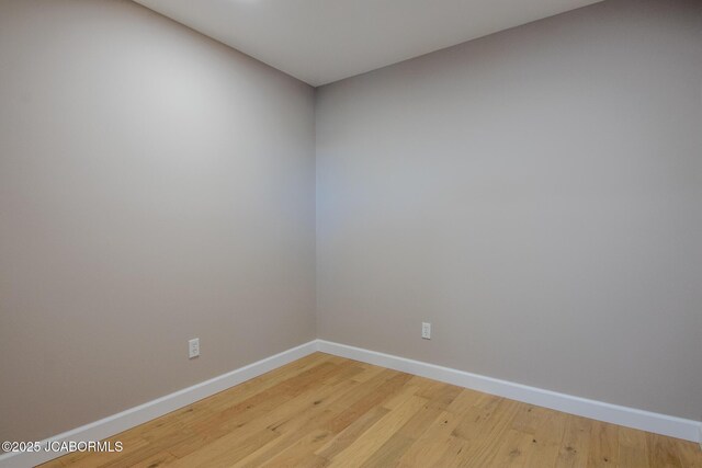 spare room featuring hardwood / wood-style floors