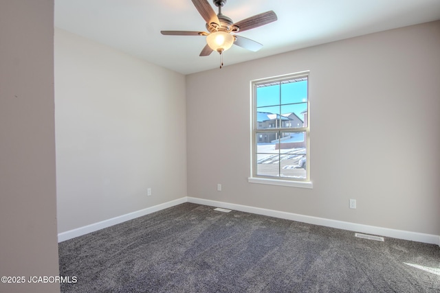 carpeted empty room featuring ceiling fan