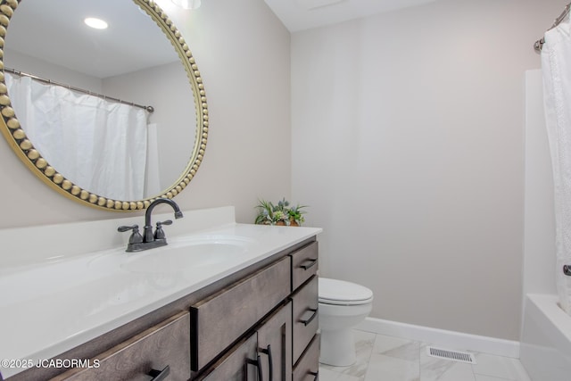 bathroom featuring toilet and vanity