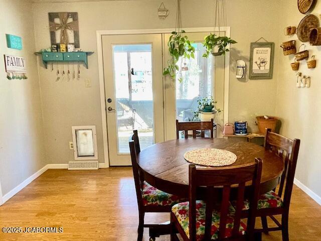 dining room with hardwood / wood-style flooring