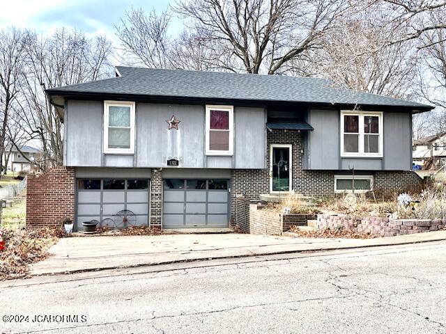 split foyer home featuring a garage