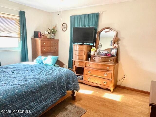 bedroom featuring hardwood / wood-style flooring