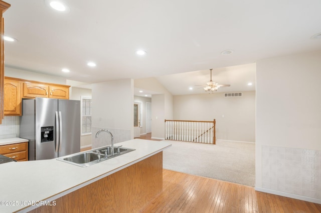 31500 Skyline Dr, California, MO 65018 - kitchen featuring stainless steel fridge, light countertops, a ceiling fan, recessed lighting, and light wood-style flooring