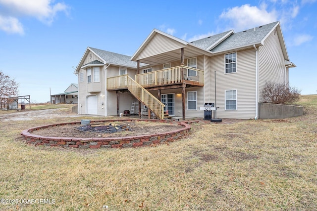 31500 Skyline Dr, California, MO 65018 - rear view of house with a garage, a deck, stairway, a lawn, and roof with shingles
