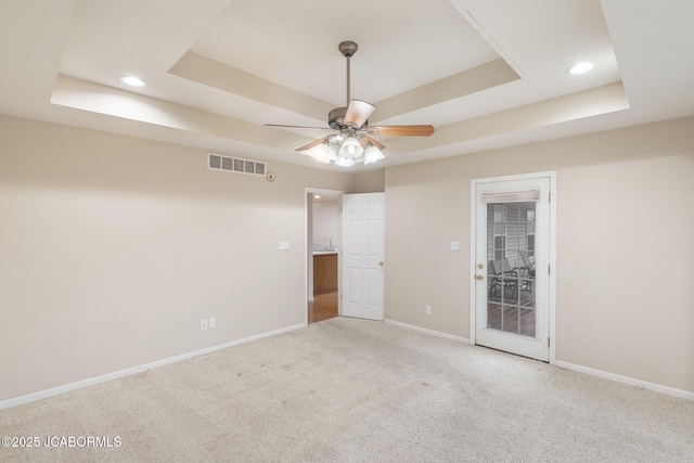 31500 Skyline Dr, California, MO 65018 - carpeted empty room with a tray ceiling, ceiling fan, and recessed lighting