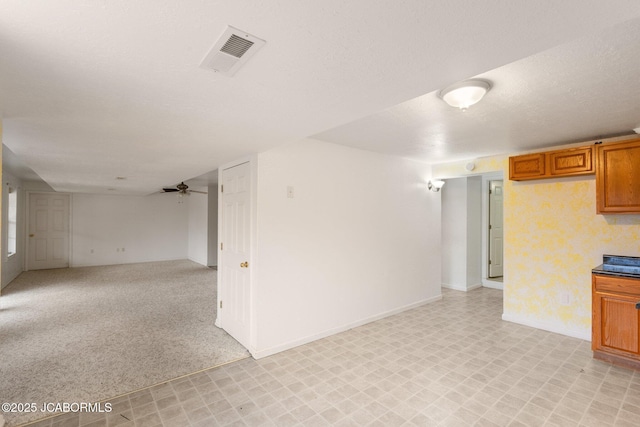 31500 Skyline Dr, California, MO 65018 - finished basement featuring ceiling fan, light floors, and a textured ceiling