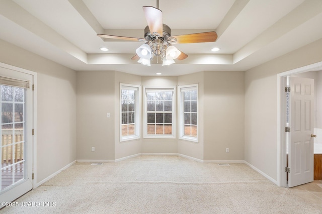 31500 Skyline Dr, California, MO 65018 - spare room with a raised ceiling, ceiling fan, carpet, and recessed lighting