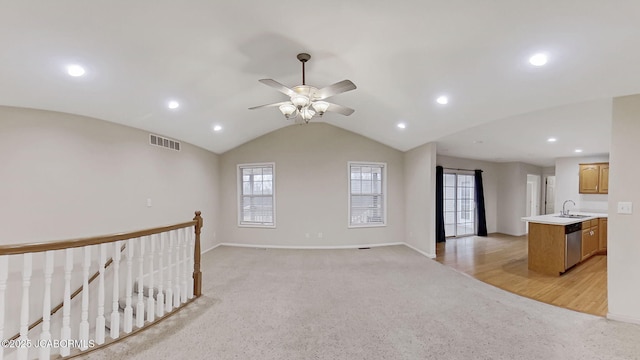 31500 Skyline Dr, California, MO 65018 - unfurnished living room featuring plenty of natural light, light carpet, ceiling fan, recessed lighting, and lofted ceiling